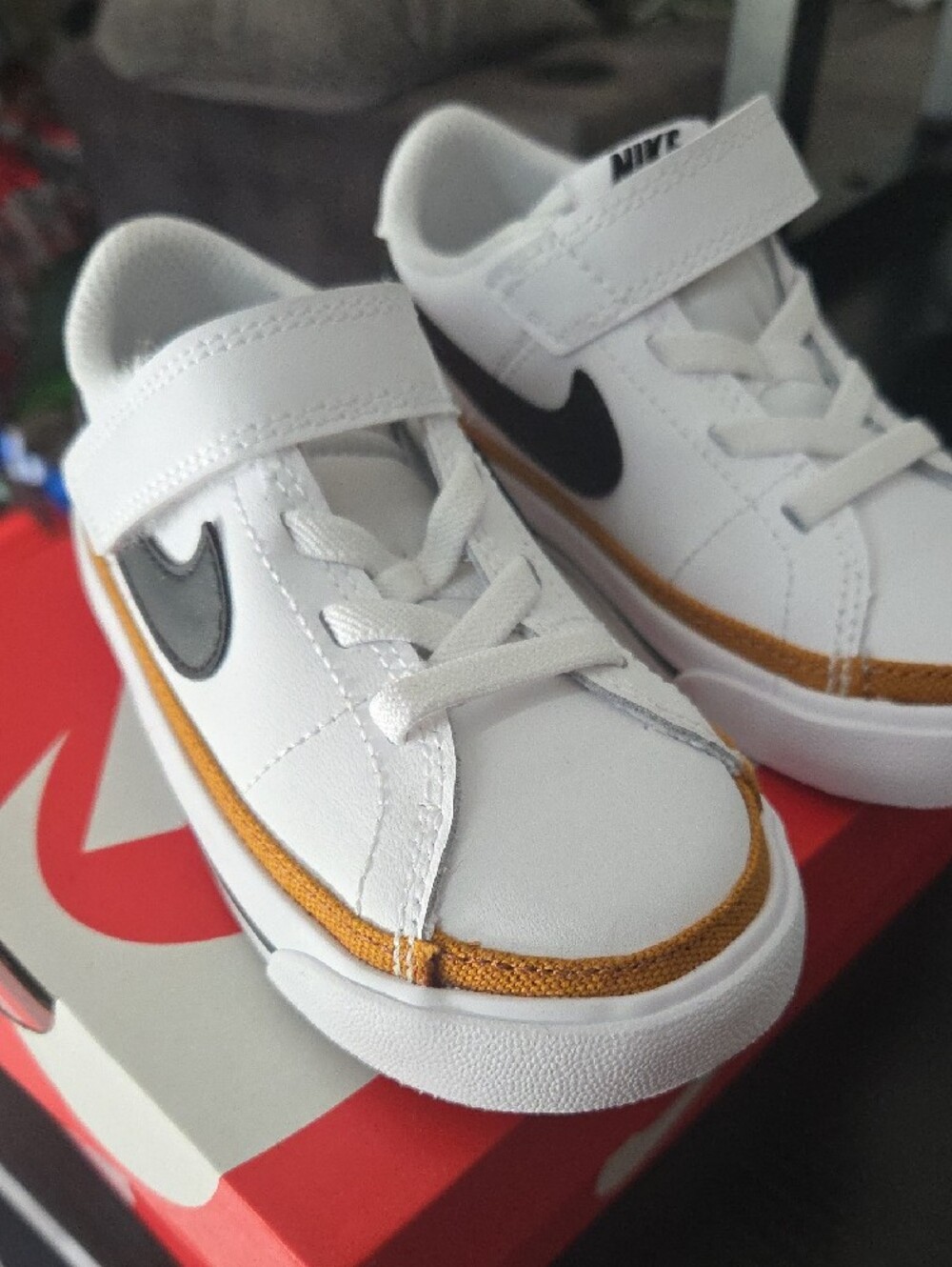 Nike Kids White Sneakers with Black Swoosh and Gold Accent - Picture 2 of 8